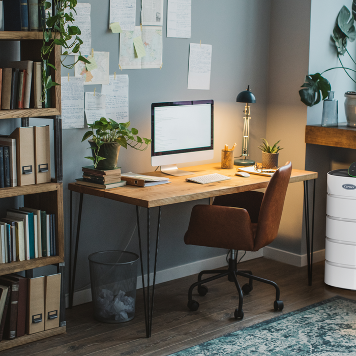 Home office displaying an air purifier to explain how to improve indoor air quality