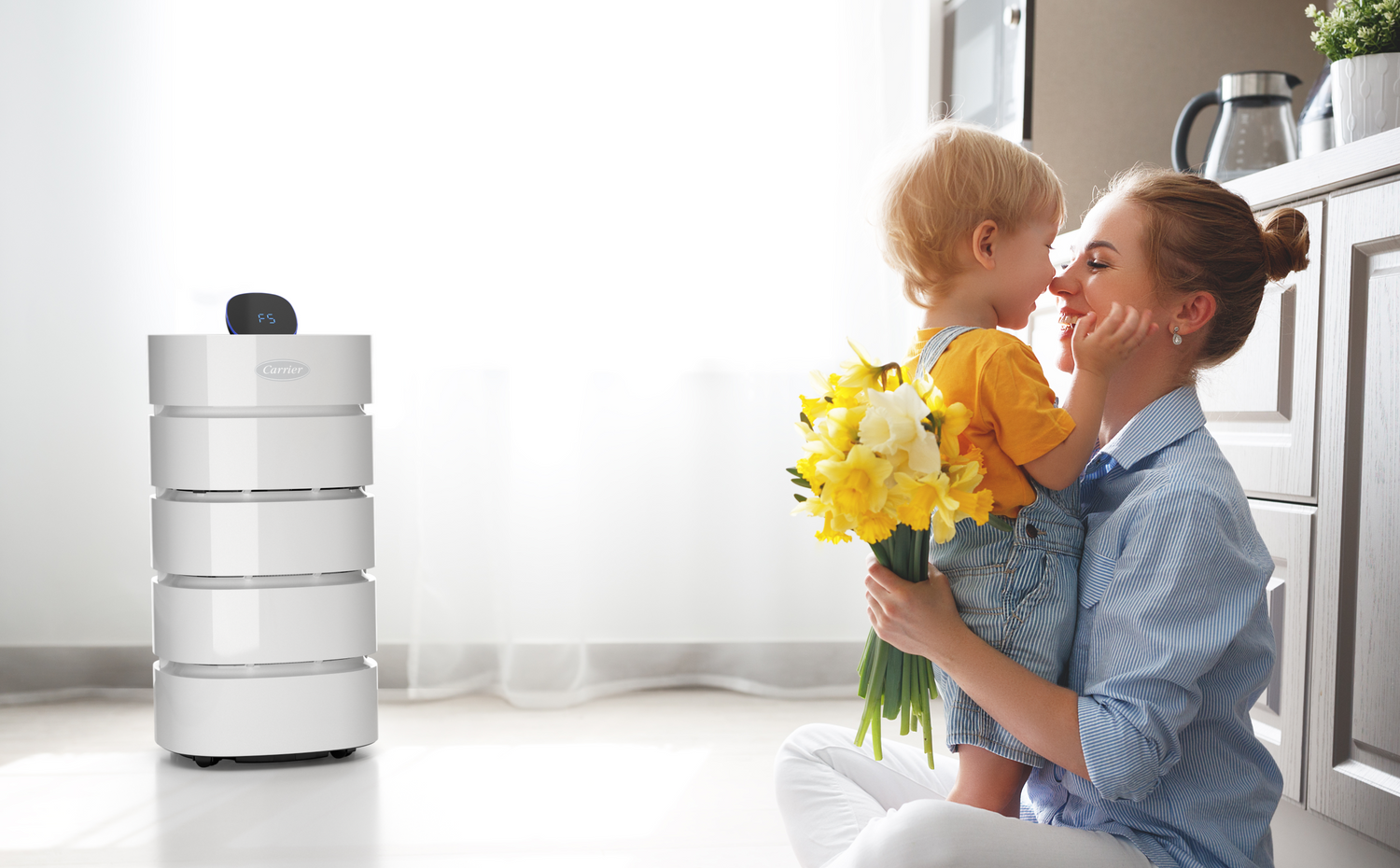 Woman and child in the kitchen with an air purifier